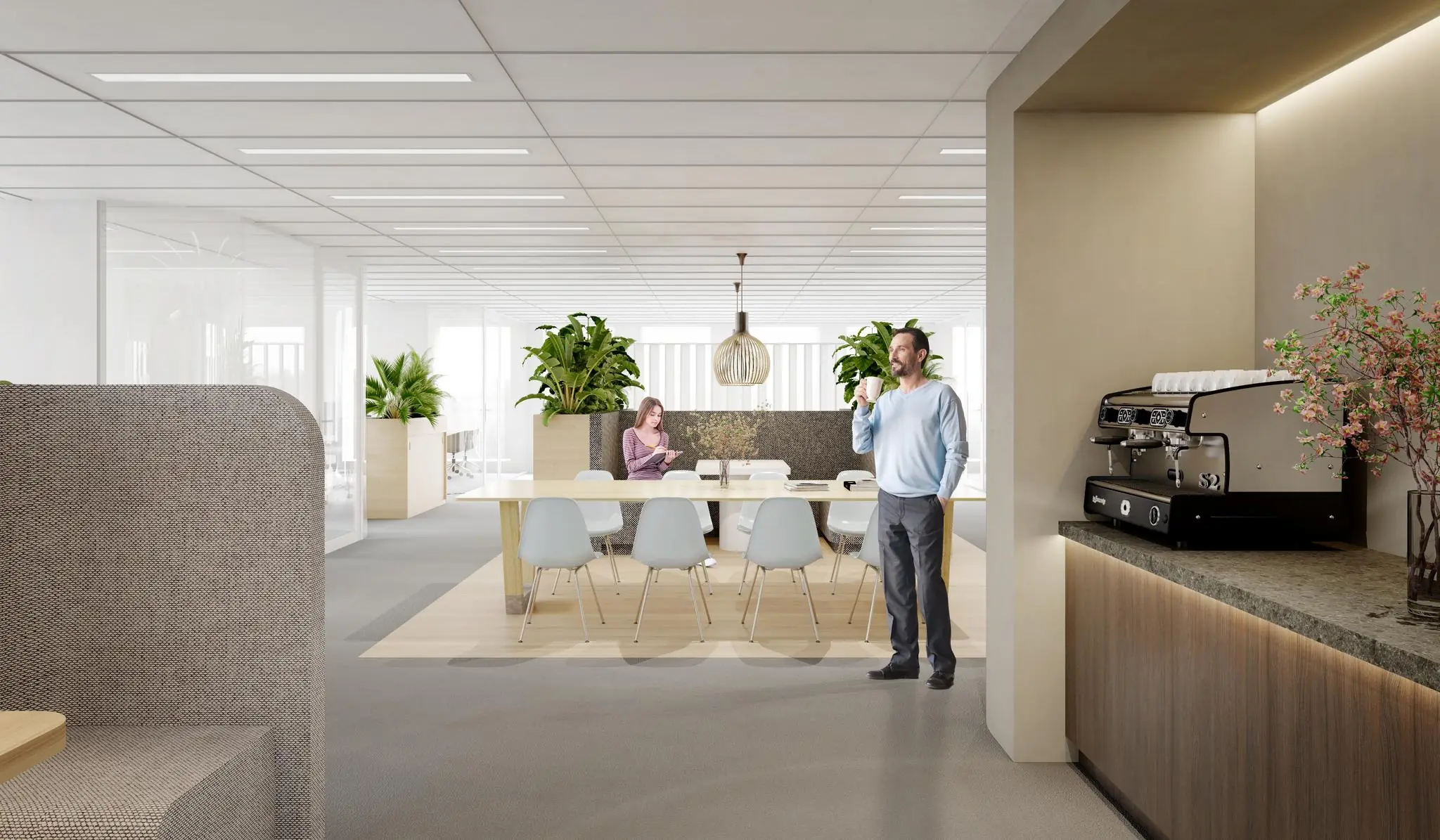 Moderne kantoorruimte aan de Fascinatio Boulevard met een koffiehoek, vergadertafel en groene planten.